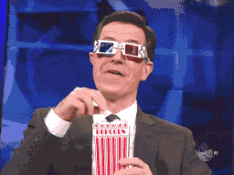 Gif of someone eating popcorn wearing 3d glasses. A joke referencing the drama Databricks opensourcing their data catalogs Data & AI Summit before Snowflake launched theirs.